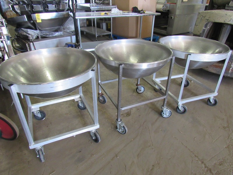 Three stainless mixing bowls with wheels